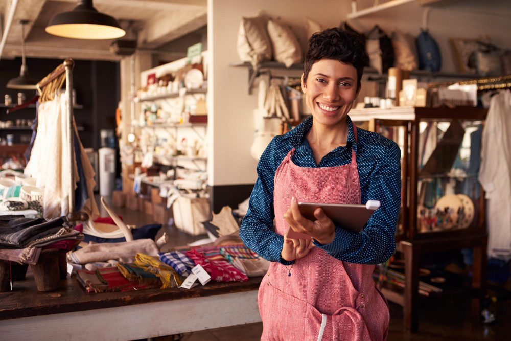 Small business owner retail store with tablet.  SBA 504 loan