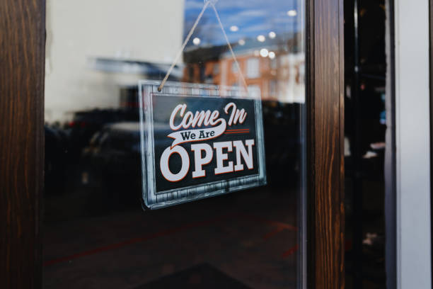 Close-up of open sign hanging from store's front door SBA Loans for Restaurants. Commercial Real Estate loans for Restaurants